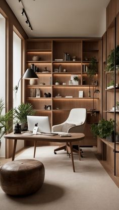 an office with wooden shelving and plants in the corner, along with a round coffee table