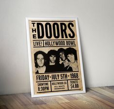 the doors concert poster displayed on wooden floor