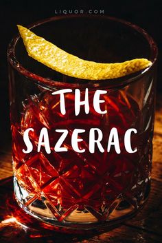 a glass filled with liquid and a lemon wedge on top of it that says sazerac