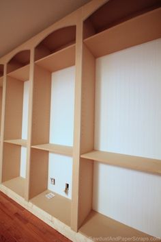 empty shelves in the corner of a room