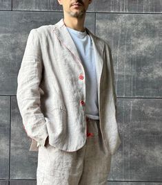 Classic linen jacket with no lining.  Handmaded by Aliona Mitko A loose ivory mélange men's linen jacket with coral buttons. Ideal on its own or as part of a suit. Offered in medium-weight washed linen. LINEN JACKET style details:  * material: 100% linen * Regular fit  * No lining * Classic jacket lapels with 4 buttons * single breasted jacket with 2 buttons on sides * 2 welt pockets on the sides. * French seams inside * Made from exclusive mid-weight washed linen. * Designer stylish embroidery (optional) Our linen blazer has a versatile classic style. It can be used for various occasions or casual wear. SIZES & COLORS IN PICTURES * Model wears size M in color BN Ivory Melange  (choose the color option "CREAM").  He is 182 cm (6'0"). Chest - 106 cm (42"), waist - 87 cm (34"), hips - 96 cm Cream Linen Suits For Spring, Cream Linen Suit For Spring, Cream Linen Notch Lapel Outerwear, Beige Linen Suits With Lapel Collar, Beige Linen Suit With Lapel Collar, White Single Button Linen Outerwear, White Linen Single Button Outerwear, White Linen Single-button Outerwear, White Linen Outerwear With Single Button