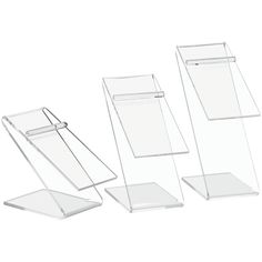 three clear acrylic displays on white background