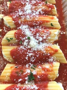 pasta shells covered in sauce and parmesan cheese