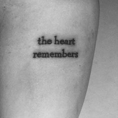 a tattoo saying the heart remembers on someone's leg