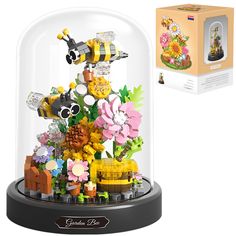 a display case filled with legos and flowers