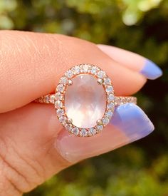 This gorgeous rose quartz ring is so elegant and delicate! definitely one of the favorites 😍 Natural Rose Quartz helps with love, self-love and inner healing <3 We all need a little bit of that, don't we? Main metal: 925 Sterling Silver (engraved)  14k Rose Gold plating  Main Stone: Natural Rose Quartz  - 10 mm (0.39 in) x 8 mm (0.31 in) Accent stones: 5A Cubic Zirconia sizes:6,7,8,9 ✔️Excellent quality ✔️hypoallergenic  ✔️free domestic shipping  ✔️free microfiber bag Processing time 1-2 busine Rose Quartz Crystal Ring In Rose Gold, Promise Ring With Rose Quartz And Gemstone Detail, Blush Gemstone Rings As Gift, Rose Quartz Crystal Ring For Promise, Blush Gemstone Rings For Gifts, Rose Gold Crystal Ring For Proposal, Rose Gold Oval Moonstone Ring, Oval Rose Gold Moonstone Ring, Rose Gold Rings With Rose Quartz For Gifts