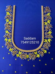 a gold necklace with green leaves on it and the name saddam 759192310