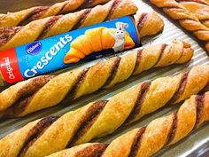 some bread sticks are lined up and ready to be eaten