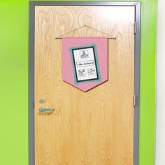 a wooden door with a pink and blue pocket on it