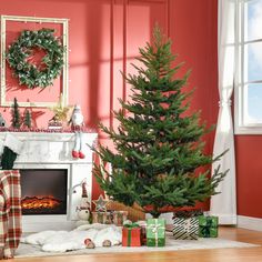 a living room decorated for christmas with presents