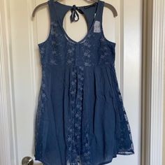 Abecrombie & Fitch Sleeveless Embroidered Lace Mini Dress Navy Size Xs Brand New With Tag The Dress Is A Baby Doll Design, Fits To Size Xs And Small Fully Lined 55% Cotton 45% Viscose Panels Of Crinkle Cotton And Embroidered Mesh V Neck Front, Round Back Finishing With A Tie 11'' Across Shoulders 16.5'' Across Armpits 36.5'' From Shoulder To Hem Longest Point 31'' From Shoulder To Hem Shortest Point I Have 2 More Dresses This Style, New With Tags In Dusty Rose And Ivory Colors All Items On My Li Sleeveless Floral Embroidery Day Dress, Sleeveless Embroidered Dresses For Daywear, Embroidered Sleeveless Dress For Daywear, Sleeveless Floral Embroidered Sundress For Summer, Casual Sleeveless Summer Dress With Floral Embroidery, Casual Sleeveless Dress With Floral Embroidery For Summer, Summer Sleeveless Mini Dress With Floral Embroidery, Casual Embroidered Sleeveless Sundress, Sleeveless Lace Sundress