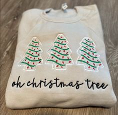 three christmas trees on a sweatshirt that says, oh christmas tree