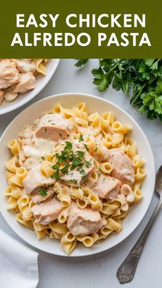 chicken alfredo pasta on a white plate with parsley in the background and text overlay that reads easy chicken alfredo pasta