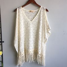 Ivory Summer Pancho Beige One Size Poncho For The Beach, Summer Beige Poncho For Vacation, Elegant One Size Summer Poncho, White Summer Poncho For Vacation, Cream Top For Spring Beach Cover-up, Cream Poncho For Beach In Spring, Summer Vacation White Poncho, Cream Poncho One Size For Spring, Chic Spring Poncho For Vacation