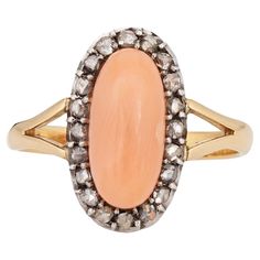 Stylish antique Victorian angel skin coral & diamond ring (circa 1880s to 1900s) crafted in 18 karat yellow gold. Cabochon cut angel skin coral measures 12mm x 5.5mm. The coral is in good condition and free of cracks or chips. 20 old rose cut diamonds total an estimated 0.20 carats (estimated at L-M color and I2-3 clarity). The light peach coral is set in a small oval shaped mount, accented with old rose cut diamonds. The cocktail ring makes a nice statement on the hand and is great for day to d Victorian Angels, Angel Skin, Old Rose, Light Peach, Rose Cut Diamond, Fine Jewellery, Antique Rings, Antique Victorian, Cocktail Ring