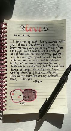 a note with an elephant on it next to a pen