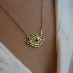 This evil eye necklace is perfect to bring meaning to your outfit. It's a protection against bad energies and it will bring Joy to your life. This design will be a favorite one to all who like to wear a beautiful and meaningful jewelry and minimalist jewelry. Product details: • 18k Gold plated evil eye necklace. • Chain size: 18" Adjustable: 2". • Pendant studded with blue and crystal zirconia stones. • Clamp closure. • All necklaces go inside the box. The gift bag will only be available if you Gold Plated Evil Eye Amulet Necklace, Gold-plated Evil Eye Amulet Necklace, Everyday Evil Eye Pendant Necklace, Spiritual Evil Eye Necklace For Everyday, Everyday Spiritual Evil Eye Necklaces, Everyday Spiritual Evil Eye Necklace, Brazilian Jewelry, See You Around, Meaningful Jewelry