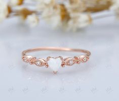 Introducing our Opal Heart Ring, a delicate and enchanting piece that embodies elegance and simplicity. This dainty opal ring features a beautiful heart-shaped opal gemstone, exuding a mesmerizing play of colors that captures the eye. Crafted with a minimalist design, it is perfect for stacking with other rings to create a personalized and unique look. As the October birthstone, opal is a symbol of hope and purity, making this ring an ideal gift for her on any occasion, whether it's an anniversa Dainty Opal Ring, Opal Heart Ring, October Birthstone Ring, October Birthstone Rings, Ring Heart, Ring Stacking, Ring Minimalist, Minimalist Ring, October Birthstone