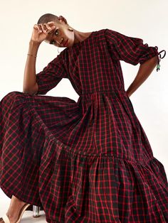 This fabric is called ‘Maasai Shuka’ and is the traditional fabric worn by the Maasai Tribe in Kenya and Tanzania. The Tiered Dress has pockets and drawstring sleeves. The beads on the dress are made from recycled glass by members of the Krobo tribe in Ghana, by using a centuries old technique. The crushed glass is shaped is heated over a fire in moulds which are made from mud. That gives the beads their frosty and uneven texture. The colour of the beads on your dress is determined by the type o Red Check Dress, Maasai Shuka, Mid Length Sleeves, Crushed Glass, Traditional Fabric, Check Dress, Maasai, Fabric Projects, A Fire