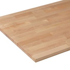 a wooden cutting board on a white background with clippings to cut into squares