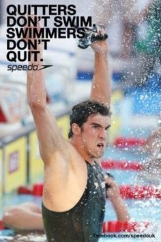 a man standing in the water with his arms up and hands raised above his head