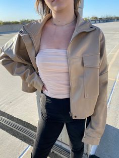 Oversized soft faux leather jacket with a cropped fit. bottom ties for optional sinching snap and zipper closure Faux Leather Jacket, Faux Leather Jackets, Ruffle Blouse, Faux Leather, Leather Jacket, Zipper, Women's Top, Leather