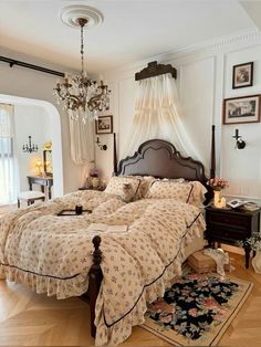 a large bed sitting inside of a bedroom on top of a hard wood floored floor