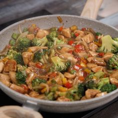 broccoli and chicken stir fry in a skillet