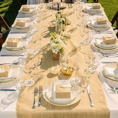 a table set with place settings and napkins