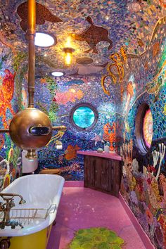 the bathroom is decorated with many different colors and designs, including an oval window in the ceiling