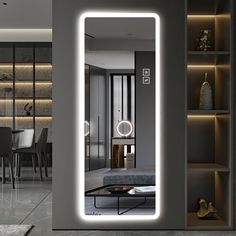 an illuminated mirror in the middle of a room