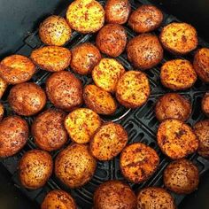 some food is cooking in an air fryer and it looks like they have been cooked