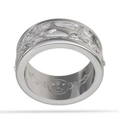 The Blue Marlin ring has 4 identical fish in a channeled band with a water feature in the field where the fish (Marlin) are set. The band is 2.5mm thick, and between 9 and 10mm wide with the channeling with fish measuring 7.5mm. This is a heavy duty men's ring and the width of the ring should be taken into consideration when measuring your finger, wider rings often require bumping up 1/4 to 1/2 ring size in under normal circumstance. Our Species Specific Fish Rings are available in Men's US ring Luxury White Gold Jewelry With Decorative Band, Luxury Sterling Silver Bands, Luxury White Gold Ring With Decorative Band, Luxury White Gold Engraved Ring With Decorative Band, Luxury Engraved Promise Ring With Decorative Band, Luxury Platinum Jewelry With Decorative Band, Anniversary White Gold Intaglio Jewelry, Luxury Silver Rings With Intaglio, White Gold Intaglio Rings For Wedding