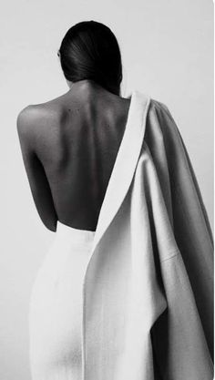 the back of a woman in a white dress