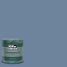 the behr paint is light beige and has a brown base with white lettering on it