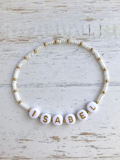 🔹This is a delicate bracelet customized with a name/word/saying of your choosing. It is made with white or black Japanese Miyuki glass seed beads and white acrylic beads with gold letters and then strung together with a strong elastic cord. It is beautiful to wear alone or to layer with other jewelry and is the perfect for yourself or for a gift. 🔹Each item is packed in a beautiful organza bag and a handwritten message can also be included. It makes the perfect gift for a baby shower, new mom, Inspirational White Jewelry For Personalized Gift, Customized Inspirational White Jewelry, Customized Adjustable Minimalist Name Bracelet, Minimalist Customized Adjustable Name Bracelet, Personalized White Bracelet Jewelry, Inspirational White Bracelets For Personalized Gifts, Inspirational White Bracelet Jewelry, Inspirational White Name Bracelet As Gift, Inspirational White Name Bracelet For Gift