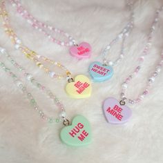 Handmade sugar heart pearl necklaces in pastel colors with sweet messages - perfect for Valentine's Day or for everyday use! Available in 5 different colors! Purple - Be Mine Blue - Sweet Heart Green - Hug Me Pink - Be Mine Yellow - Be Mine Clasp and extension are made of a metal alloy - silver colored coated. The length is adjustable from approx. 43 cm to 46 cm. Since the chains are fashion jewelry, I recommend taking them off before exercising and sleeping, and protecting them from water. Due Cute White Necklace With Heart Beads, Cute White Heart-shaped Beaded Necklace, Sweet Pink Necklaces For Valentine's Day, Kawaii Necklaces For Valentine's Day, Sweet Pink Necklace For Valentine's Day, Cute Necklace For Birthday And Valentine's Day, Cute Handmade Charm Necklaces For Valentine's Day, Handmade Cute Charm Necklaces For Valentine's Day, Cute White Heart Necklace For Valentine's Day