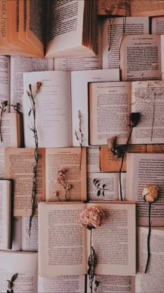 many open books with flowers on them are arranged in the shape of a wallpaper