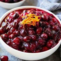 two bowls filled with cranberry sauce and orange zest