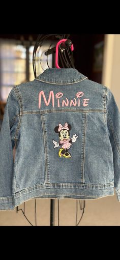 Denim jacket embriordered with pink Minnie Mouse.  Not all jackets are the same blue. If you would like to see the jacket before it's made, feel free to message me. Personalized Minnie Mouse Jean Jacket Pink, Cute Pink Denim Jacket With Pockets, Cute Pink Denim Jacket With Long Sleeves, Cute Pink Long Sleeve Denim Jacket, Cute Embroidered Long Sleeve Denim Jacket, Cute Denim Blue Spring Outerwear, Denim Blue Cute Spring Outerwear, Cute Fitted Embroidered Outerwear, Cute Fitted Denim Jacket With Pockets