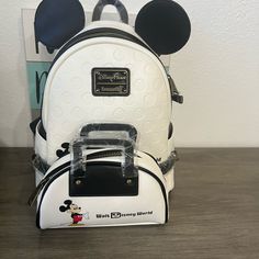 Walt Disney World Disney White Bags For Disney Trips, Disney Leather School Bags, Disney White Travel Shoulder Bag, Disney Style White Shoulder Travel Bag, White Disney Everyday Bag, Disney Style White Everyday Bags, White Disney Bags For Everyday Use, White Disney Style Bag, Snow White Evil Queen