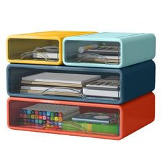 three plastic storage containers stacked on top of each other with books and binders in them