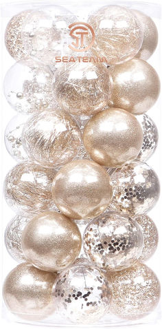 gold and silver ornaments in a clear box