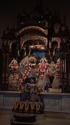 an elaborately decorated statue in the middle of a room