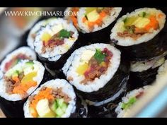 sushi rolls with vegetables and meat are on a plate