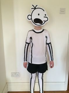 a person wearing a costume made to look like a cartoon character standing in front of a white wall