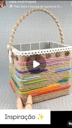 a person is holding a basket made out of woven material