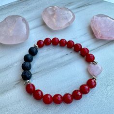 This adorable bracelet features faceted Red Jade gemstones, a Rose Quartz heart, lava stones, and Tibetan silver accent beads. Made with high quality elastic cord. Beads are 8mm which is slightly larger than the size of a pea. *To use as a diffuser bracelet, apply a drop or two of 100% pure essential oil to the lava stones. The scent will last for 1-2 days. Red Jade Healing Properties: Good Luck, Peace, Tranquility Rose Quartz Healing Properties: Love, Compassion & Acceptance Lava rock is known Spiritual Heart-shaped Beaded Bracelets For Valentine's Day, Heart-shaped Bracelets With Faceted Beads For Gifts, Heart Shaped Bracelets With Faceted Beads For Gifts, Heart-shaped Bracelet With Faceted Beads For Gifts, Heart-shaped Faceted Beads Bracelet Gift, Spiritual Beaded Bracelets For Valentine's Day, Valentine's Day Adjustable Bracelets With Faceted Beads, Valentine's Day Gift Beaded Bracelet With Faceted Beads, Valentine's Day Adjustable Beaded Bracelets With Faceted Beads