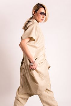 The Beige Linen Tunic is our favorite weekender. Featuring an oversized relaxed fit and a back button down closing. This avant garde clothing featuring short sleeve and it is made of lightweight Italian linen, that is versatile for any occasion! The Plus size linen shirt is designed to be comfortable and not troublesome to wear. After wearing this Womens linen top, you will love it even more. ▸FABRIC & CAR You will enjoy wearing Beige Linen Tunic which is made of 100% pure linen - Italy ▸SIZ Versatile Summer Tunic With Relaxed Fit, Summer Lagenlook Blouse, Spring Linen Lagenlook Blouse, Spring Lagenlook Linen Blouse, Oversized Chic Linen Dress For Spring, Asymmetrical Linen Summer Top, Summer Lagenlook Linen Dress, Oversized Linen Tunic Dress For Spring, Oversized Linen Dress For Spring