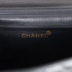 This vintage Chanel Kelly Top Handle Flap Bag is in black caviar leather with gold hardware, featuring the signature CC turnlock closure with front flap, half moon back pocket and a black rolled top handle.The interior is lined in black leather and includes one zip pocket with logo pull and a slip pocket underneath on the rear wall.Collection: 4-series (1996-1997)Origin: FranceCondition: Vintage; Excellent to Mint - This bag retains its structure. There is no plastic on the hardware which shows moderate scratching. There's some light creasing to the exterior leather but not other signs of wear. The interior is clean with a few small press markings to the interior base. Date stamp sticker is still intact.Accompanied by: Chanel box, dustbag, carebook, COA cardMeasurements: 12" width x 9" hei Chanel Kelly, Date Stamp, Chanel Box, Black Caviar, Carry All Bag, Black Excellence, Vintage Chanel, Fendi Bags, Flap Bag